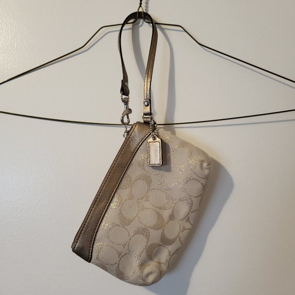 Coach silver/pale pink wristlet